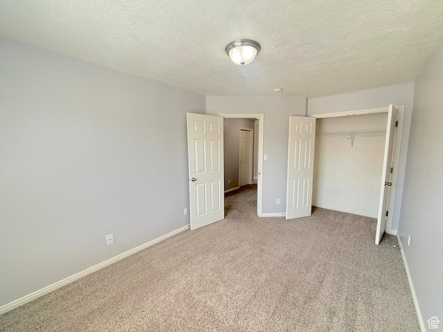10521 S Sage Flats Way S, Jordan, UT 84009 - unfurnished bedroom with light colored carpet, a closet, and a textured ceiling