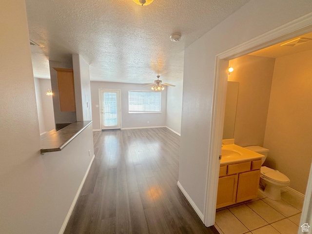 10521 S Sage Flats Way S, Jordan, UT 84009 - corridor featuring a textured ceiling and wood finished floors