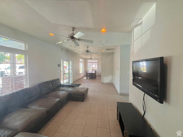 10521 S Sage Flats Way S, Jordan, UT 84009 - living room featuring light tile patterned floors, a ceiling fan, and recessed lighting