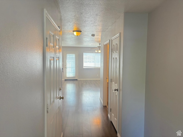10521 S Sage Flats Way S, Jordan, UT 84009 - hallway with a textured ceiling and dark wood-style flooring