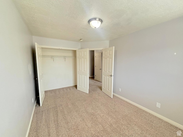 10521 S Sage Flats Way S, Jordan, UT 84009 - unfurnished bedroom with a textured ceiling, a closet, and light colored carpet