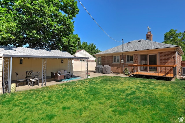 2090 E Crystal Ave S, Salt Lake City, UT 84109 - back of house featuring a wooden deck, a patio, brick siding, a chimney, and roof with shingles