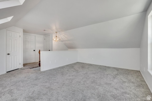 1040 E 900 N, Orem, UT 84097 - bonus room with lofted ceiling, a skylight, carpet flooring, and a chandelier