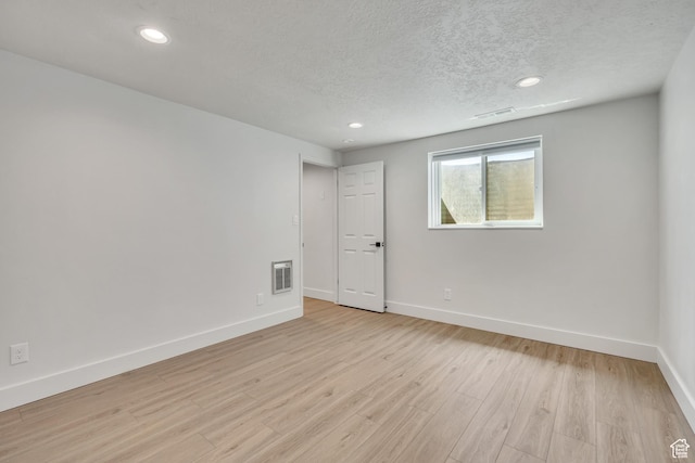 1040 E 900 N, Orem, UT 84097 - spare room with a textured ceiling, light wood finished floors, and recessed lighting