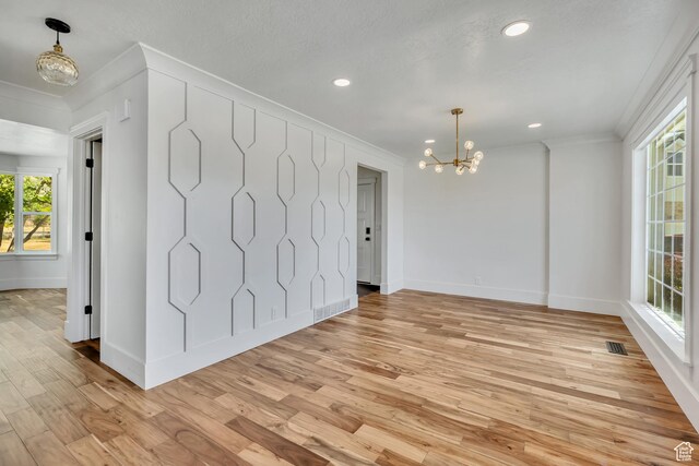 1040 E 900 N, Orem, UT 84097 - spare room featuring a chandelier, crown molding, plenty of natural light, light wood-style flooring, and recessed lighting