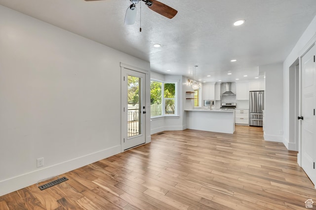 1040 E 900 N, Orem, UT 84097 - unfurnished living room featuring ceiling fan, recessed lighting, and light wood-style floors
