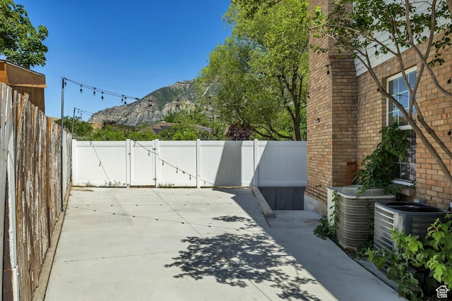 1040 E 900 N, Orem, UT 84097 - fenced backyard with a mountain view, a patio, and a gate