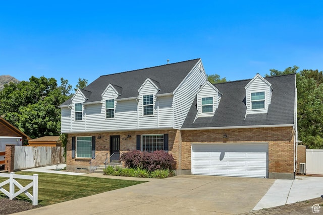 1040 E 900 N, Orem, UT 84097 - view of front facade featuring brick siding, concrete driveway, and a shingled roof