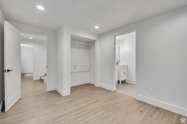1040 E 900 N, Orem, UT 84097 - unfurnished bedroom featuring light wood-type flooring, recessed lighting, a closet, and ensuite bathroom