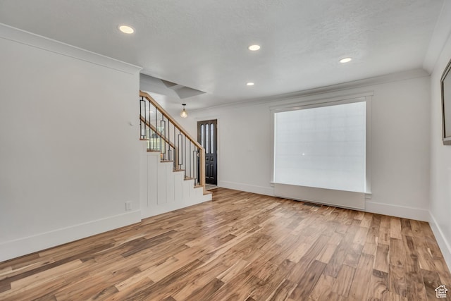 1040 E 900 N, Orem, UT 84097 - empty room featuring wood finished floors, stairway, recessed lighting, crown molding, and a textured ceiling