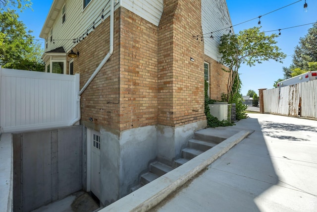 1040 E 900 N, Orem, UT 84097 - view of property exterior featuring brick siding and a central AC unit