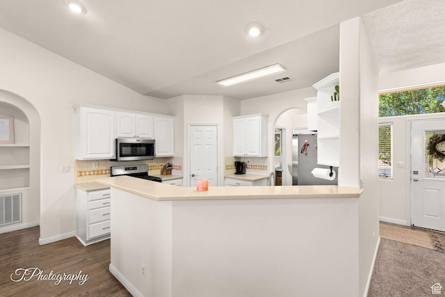 2640 W 200 N, Hurricane, UT 84737 - kitchen with stainless steel appliances, open shelves, white cabinets, arched walkways, and lofted ceiling