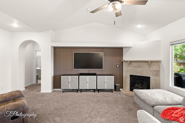 2640 W 200 N, Hurricane, UT 84737 - carpeted living area with arched walkways, lofted ceiling, ceiling fan, and a tiled fireplace
