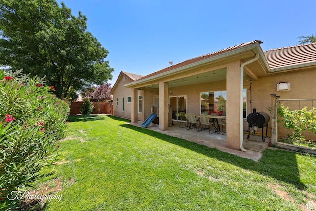 2640 W 200 N, Hurricane, UT 84737 - back of house with a fenced backyard, stucco siding, and a patio area