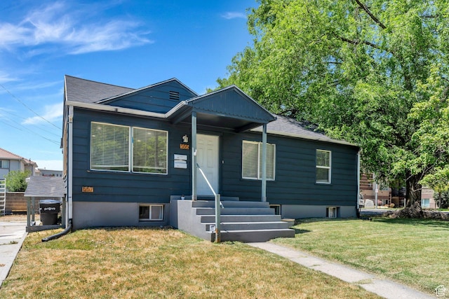 555 N 800 E, Provo, UT 84606 - bungalow featuring a front yard, entry steps, and a shingled roof