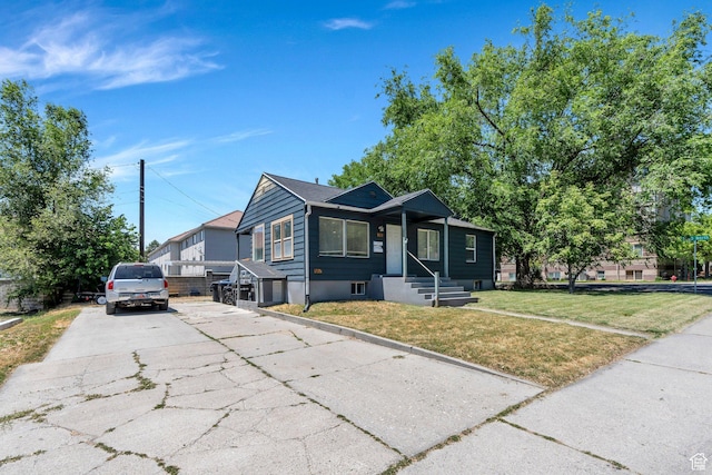 555 N 800 E, Provo, UT 84606 - bungalow-style home with concrete driveway and a front yard