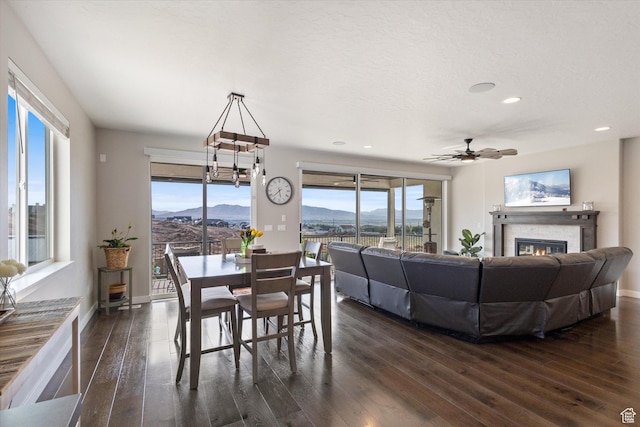 1414 S 790 E, Salem, UT 84653 - dining room with dark wood-style flooring, a glass covered fireplace, ceiling fan, healthy amount of natural light, and recessed lighting