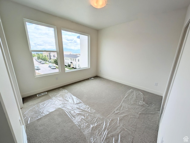 10634 S Cardinal Park Rd W Unit 148, South Jordan, UT 84009 - spare room with carpet floors and baseboards