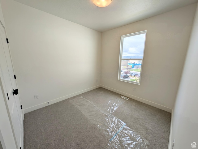 10634 S Cardinal Park Rd W Unit 148, South Jordan, UT 84009 - spare room with carpet floors and baseboards