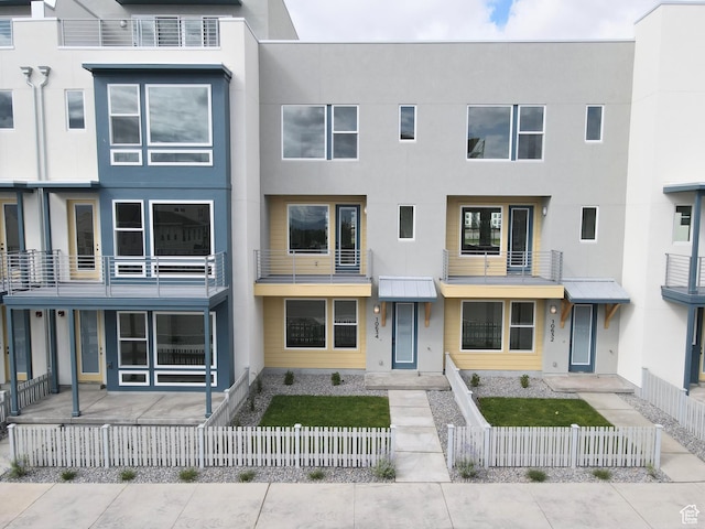 10634 S Cardinal Park Rd W Unit 148, South Jordan, UT 84009 - view of building exterior featuring a fenced front yard