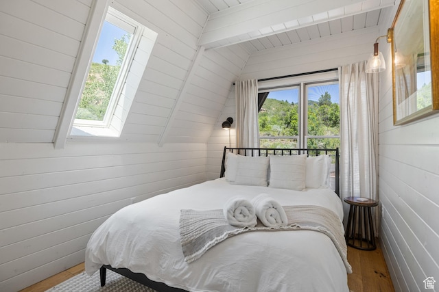 7630 Lake Creek Rd, Heber City, UT 84032 - bedroom with wood finished floors, a skylight, wooden walls, and wood ceiling