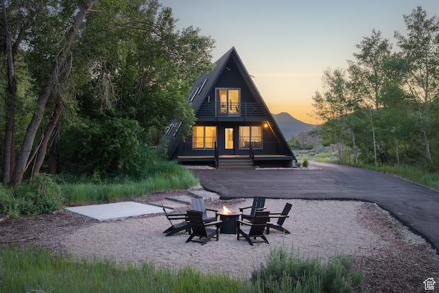 7630 Lake Creek Rd, Heber City, UT 84032 - back of property with an outdoor fire pit and a balcony