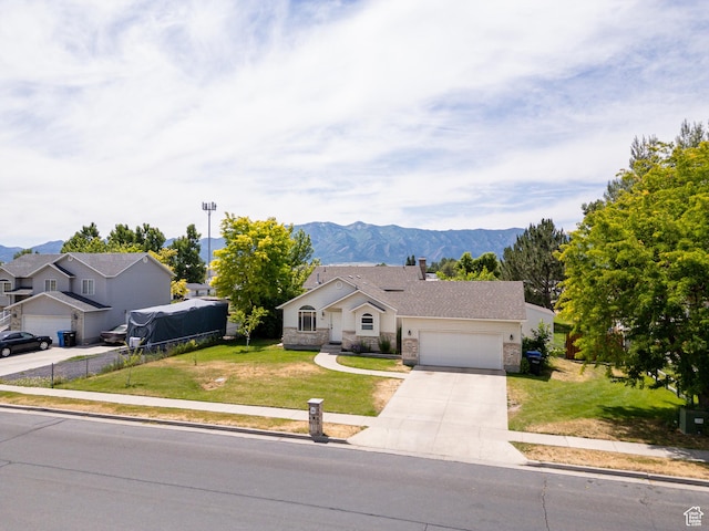 2891 S 600 W, Nibley, UT 84321 - ranch-style house featuring an attached garage, concrete driveway, stone siding, and a front lawn
