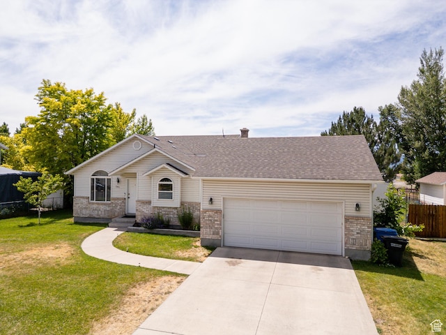2891 S 600 W, Nibley, UT 84321 - view of front of home with brick siding, concrete driveway, a garage, a chimney, and a shingled roof
