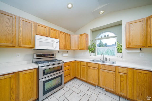 2891 S 600 W, Nibley, UT 84321 - kitchen with white microwave, double oven range, vaulted ceiling, light countertops, and recessed lighting