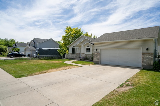 2891 S 600 W, Nibley, UT 84321 - view of front of home featuring driveway, a garage, and brick siding