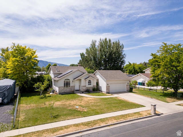 2891 S 600 W, Nibley, UT 84321 - view of front facade with driveway, a garage, and a mountain view