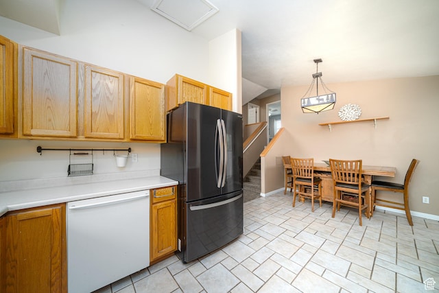 2891 S 600 W, Nibley, UT 84321 - kitchen featuring freestanding refrigerator, dishwasher, lofted ceiling, light countertops, and decorative light fixtures