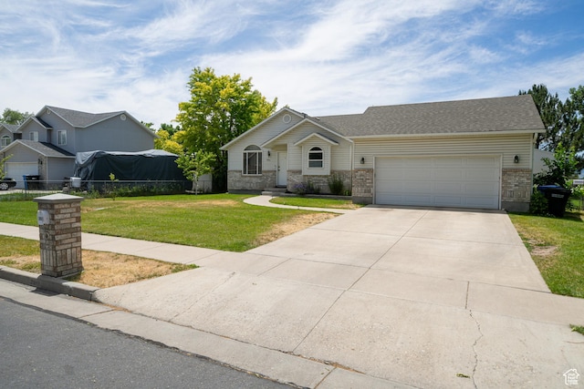 2891 S 600 W, Nibley, UT 84321 - view of front of property featuring brick siding, concrete driveway, and a garage