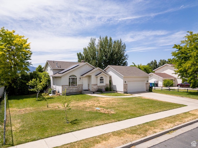 2891 S 600 W, Nibley, UT 84321 - ranch-style house with driveway, roof mounted solar panels, and an attached garage