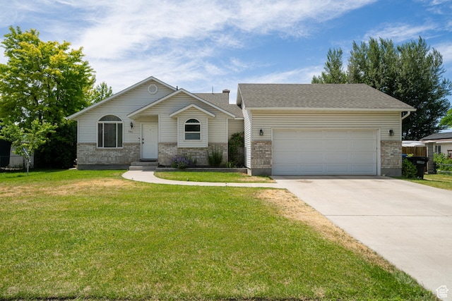 2891 S 600 W, Nibley, UT 84321 - view of front facade featuring an attached garage, driveway, a front lawn, brick siding, and roof with shingles
