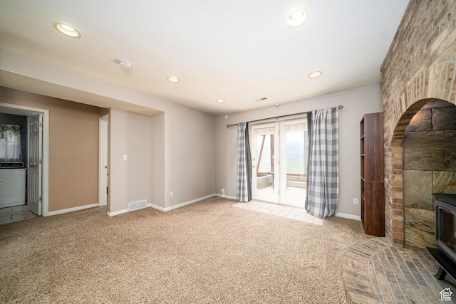 2891 S 600 W, Nibley, UT 84321 - unfurnished living room with a wood stove, carpet floors, and recessed lighting