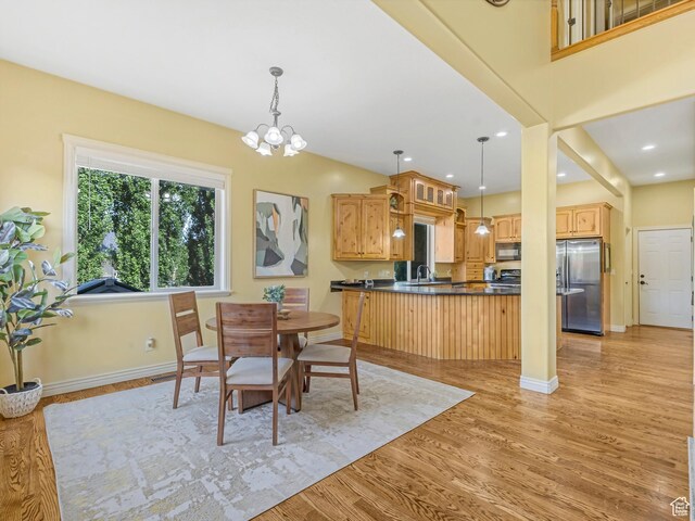 385 W Riverside Ln, Spanish Fork, UT 84660 - dining area featuring light wood-style floors, a chandelier, and recessed lighting