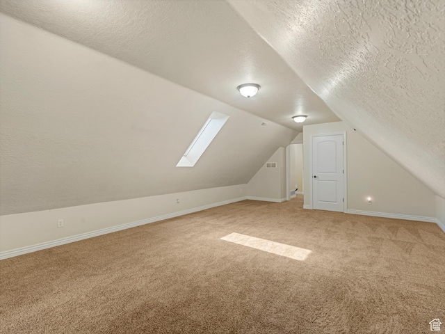 385 W Riverside Ln, Spanish Fork, UT 84660 - bonus room with a textured ceiling, light colored carpet, lofted ceiling, and a skylight