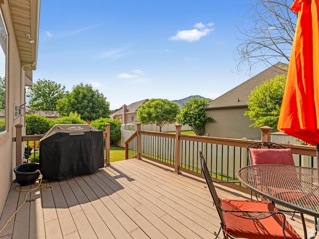 385 W Riverside Ln, Spanish Fork, UT 84660 - wooden deck with grilling area, a mountain view, and a fenced backyard