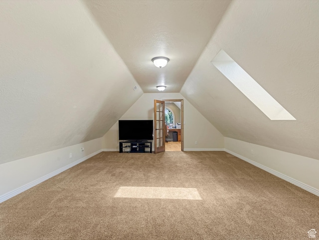 385 W Riverside Ln, Spanish Fork, UT 84660 - additional living space featuring carpet, vaulted ceiling, and a skylight