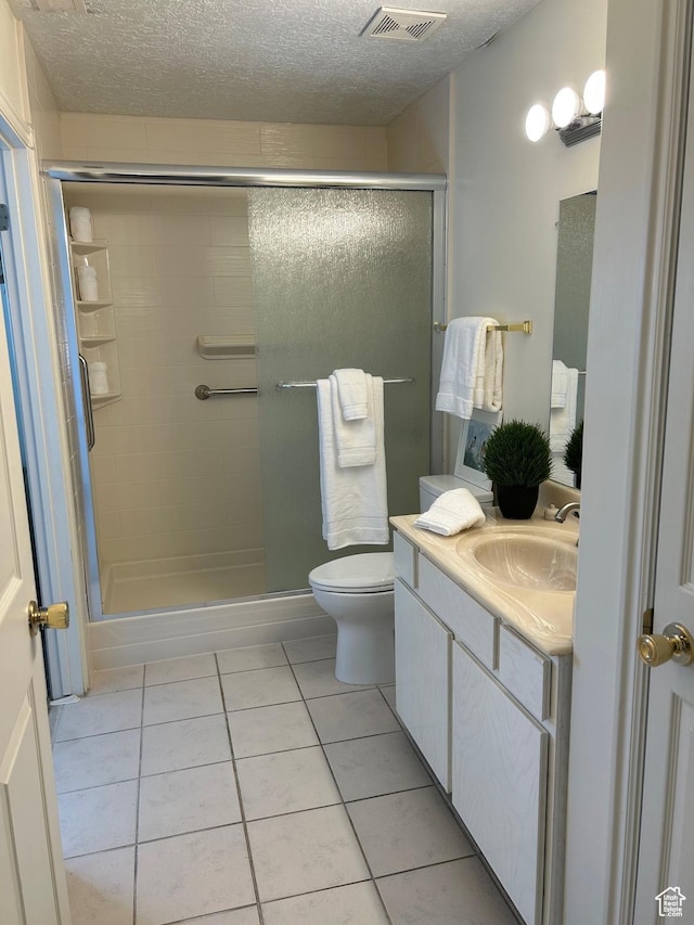 2839 S Vanburen Ave E Unit 8, Ogden, UT 84403 - bathroom with tile patterned floors, a stall shower, vanity, and a textured ceiling
