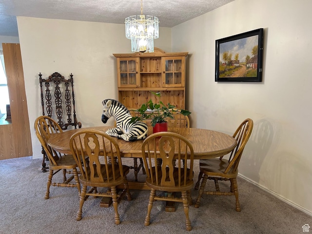 2839 S Vanburen Ave E Unit 8, Ogden, UT 84403 - carpeted dining room featuring a chandelier and a textured ceiling