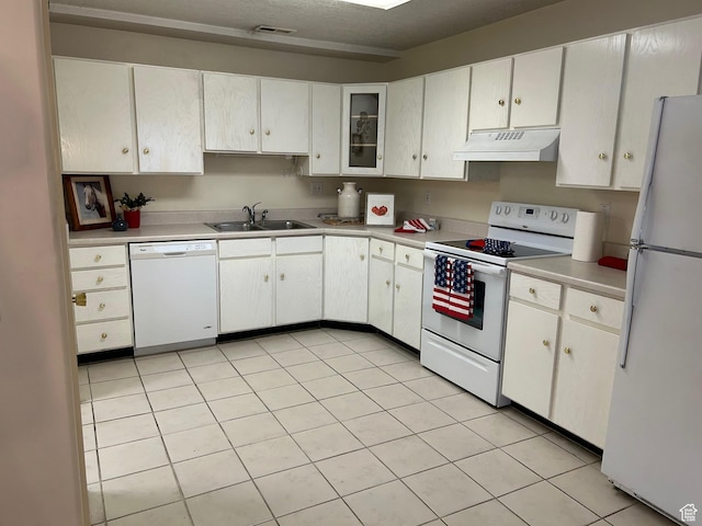 2839 S Vanburen Ave E Unit 8, Ogden, UT 84403 - kitchen with white appliances, under cabinet range hood, white cabinetry, and light countertops