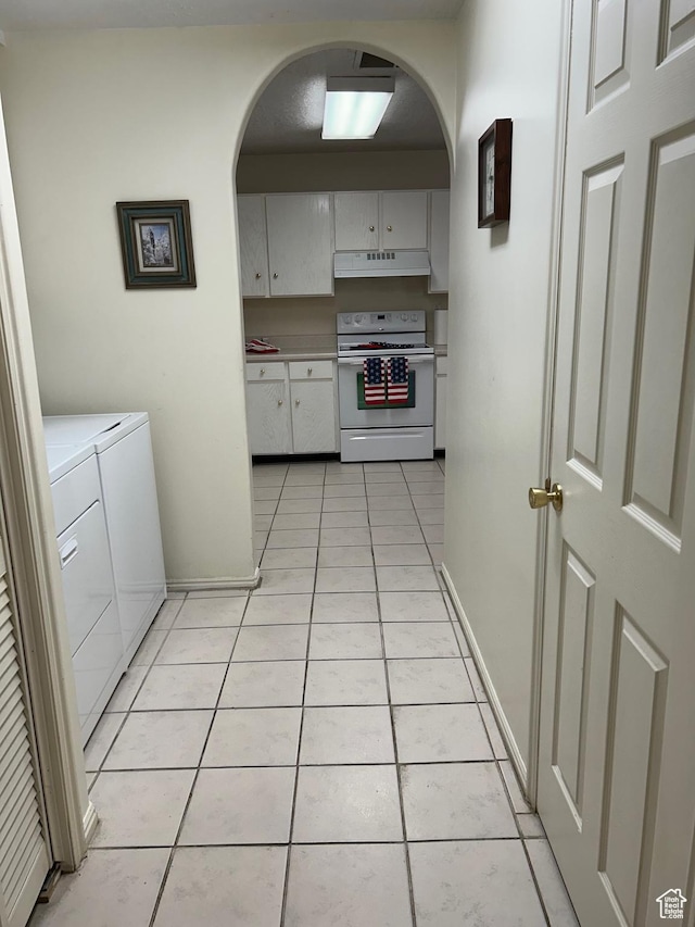 2839 S Vanburen Ave E Unit 8, Ogden, UT 84403 - kitchen with white range with electric cooktop, washing machine and dryer, arched walkways, and under cabinet range hood