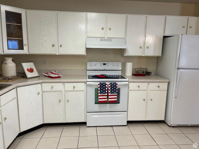 2839 S Vanburen Ave E Unit 8, Ogden, UT 84403 - kitchen featuring white appliances, premium range hood, light countertops, and light tile patterned floors