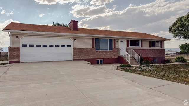 7166 S 4000 E, Price, UT 84501 - ranch-style home featuring brick siding, a chimney, and concrete driveway