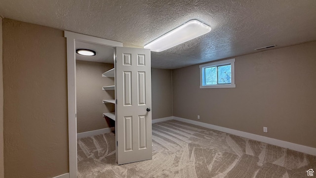 7166 S 4000 E, Price, UT 84501 - below grade area featuring a textured ceiling and carpet