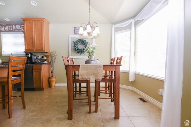 615 W 850 N, Tooele, UT 84074 - dining space with a chandelier, healthy amount of natural light, vaulted ceiling, and light tile patterned floors