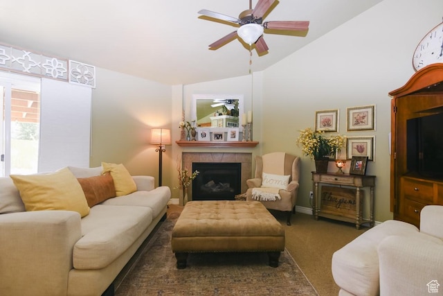 615 W 850 N, Tooele, UT 84074 - living room featuring vaulted ceiling, carpet floors, ceiling fan, and a tiled fireplace