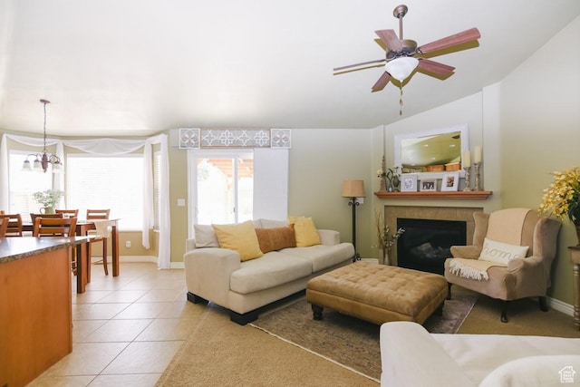 615 W 850 N, Tooele, UT 84074 - living room featuring light tile patterned flooring, ceiling fan, and a tiled fireplace